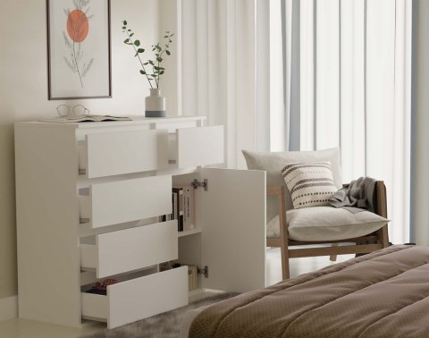 Funkcjonalne wykorzystanie blatu i pojemnego wnętrza komody 100 cm – model KOM-932-BIEL-MAT w wizualizacji bocznej.