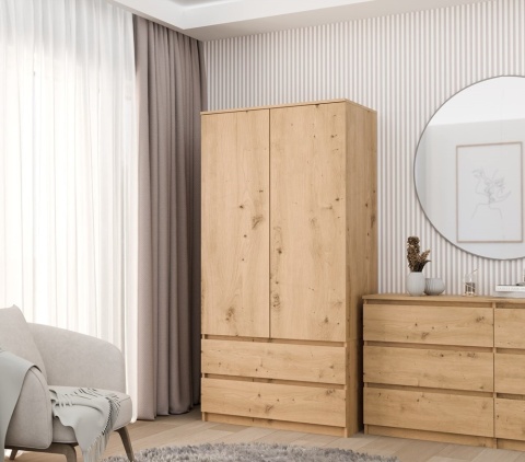 Stylowe wnętrze z funkcjonalną szafą 90cm dąb artisan SZAF-1008-ART w półprofilu.