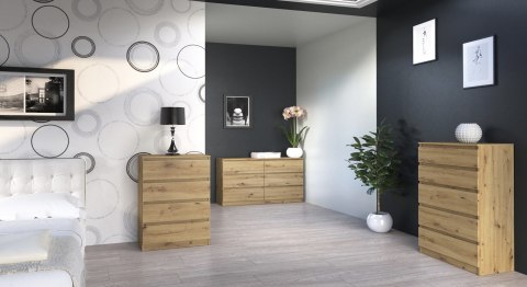 Wizualizacja przytulnej sypialni z szeroką komodą KOM-906-ART w dębie artisan, ustawioną na tle eleganckiej, grafitowej ściany.