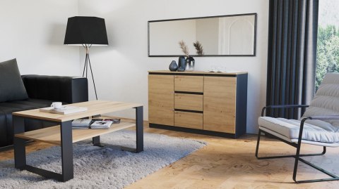 Stylowe wnętrze nowoczesnego salonu z antracytową komodą KOM-912-ANT-ART-BA w półprofilu.