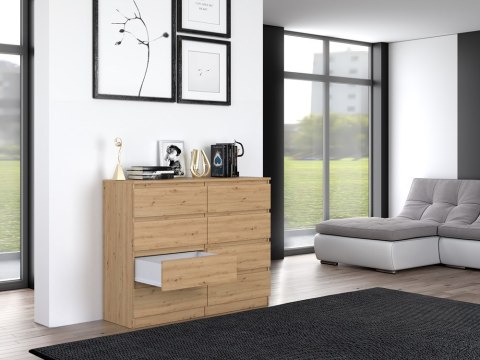 Stylowe wnętrze salonu z otwartą komodą 120 cm dąb artisan KOM-907-ART w półprofilu.